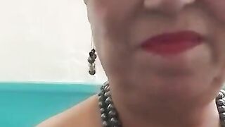 Pissing in a public bathroom. 67yo mature woman.