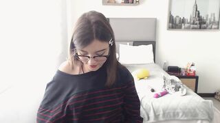 Cute nerdy Colombian girl pulls down her jeans and panties