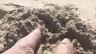 BIG FEET playing in the sand