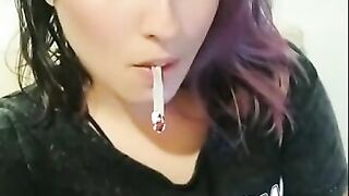 POV Look into my eyes smoking and staring at the camera with different color of hair. Cute alt girl