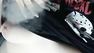 Smoking chubby goth milf  showing her tits and pussy in car