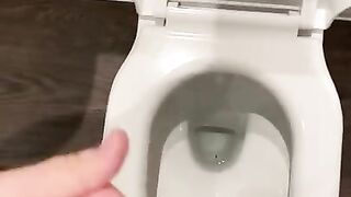 Wanking off in public cubicle with big cumshot at the end