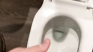 Wanking off in public cubicle with big cumshot at the end