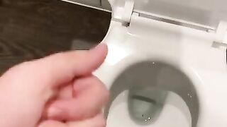 Wanking off in public cubicle with big cumshot at the end