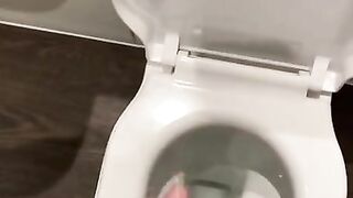 Wanking off in public cubicle with big cumshot at the end