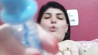 horny brunette sticking toy in pussy