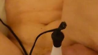 While inserting a dick, the clitoris is attacked with an electric massage machine