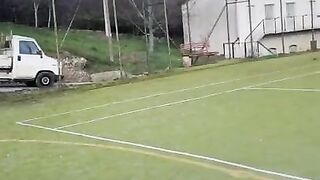 Hand job outside in soccer field