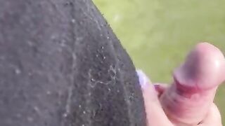 Hand job outside in soccer field