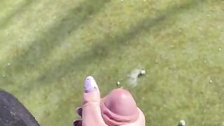 Hand job outside in soccer field