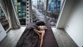 A fragile girl lays by the window and masturbates her holes in Vancouver center