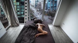 A fragile girl lays by the window and masturbates her holes in Vancouver center