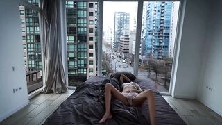 A fragile girl lays by the window and masturbates her holes in Vancouver center