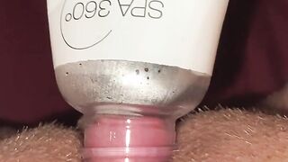 Horny and desperate girl uses a bottle to suck clit